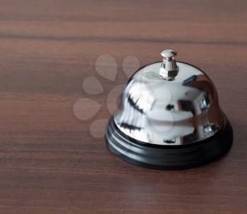 Service bell ring on wooden background
