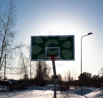 Basketball in winter time on open area