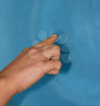 Human finger touch the water