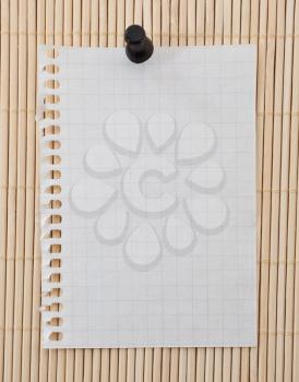 Blank sheet with clip on wooden background
