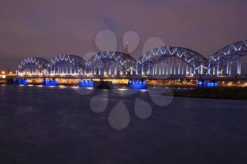 The railway bridge in Riga on the Daugava river, evening