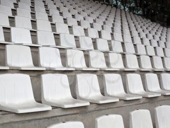 White plastic chairs on the stadium