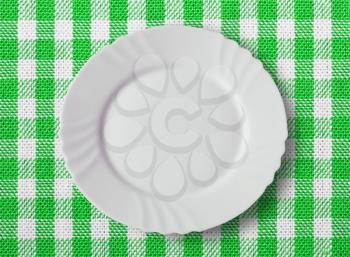 Lined white and green dining cloth with plate