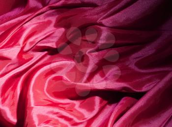 Dark red satin or silk background texture