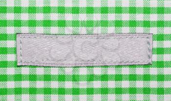 Green lined clothes with small label
