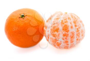 Two tangerines, one without skin isolated on white background