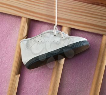 Children's boot on a cot