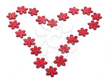 Red heart from snowflakes isolated on white