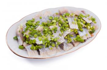 Herring with cut onion on the plate