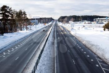 Four line highway road in winter time