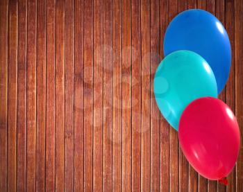 Balloons on the wooden background