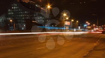 Riga street at night with moving cars