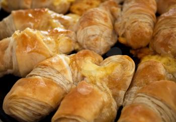 Delicious yellow croissants for background