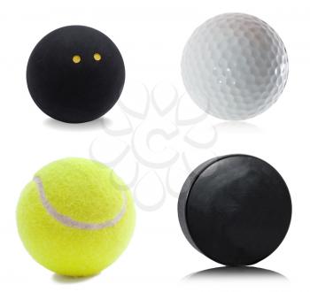 Hockey puck, squash, tennis and golf ball isolated on white background