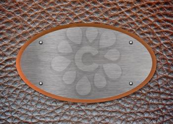Leather surface with metallic label