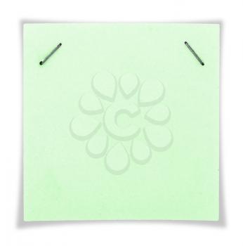 Green paper sheet sticked with paper clips