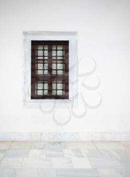 White wall with window and marble floor