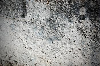 Dark weathered stone wall