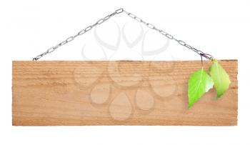 Wooden sign board on  chain with green leaves