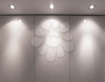 Wall with three light sources