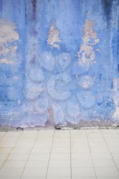 Blue weathered wall on the street