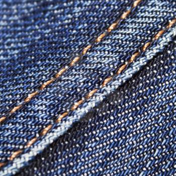 Blue jeans texture  with dark golden thread