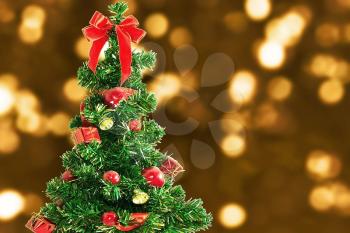 Christmas holiday bokeh and fir tree with bow
