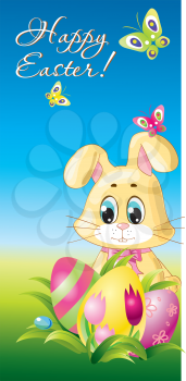 Easter Rabbit with eggs  in the grass on blue sky background 