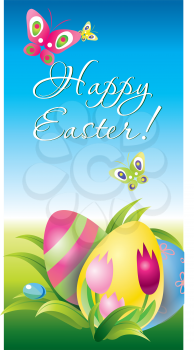 Colorful Easter eggs  in the grass on blue sky background 