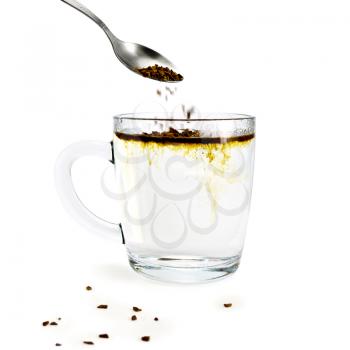 Royalty Free Photo of Instant Coffee Being Put Into a Cup
