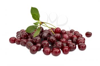Heap of ripe cherries with green leaf isolated on white background