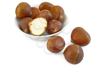 Chestnuts in a bowl and on the table isolated on white background