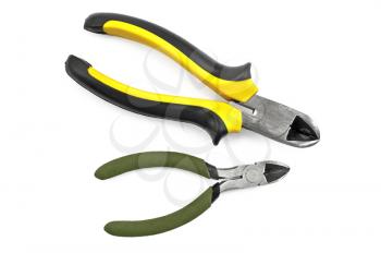 Two cutter with a yellow-black and green rubber handles isolated on a white background
