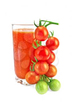 Tomato juice in a tall glass with a sprig of small tomatoes isolated on white background