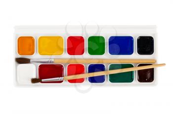 A box of paints, two brushes isolated on white background
