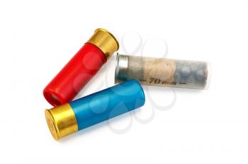 Three ammunitions for a rifle, red, blue and white isolated on white background