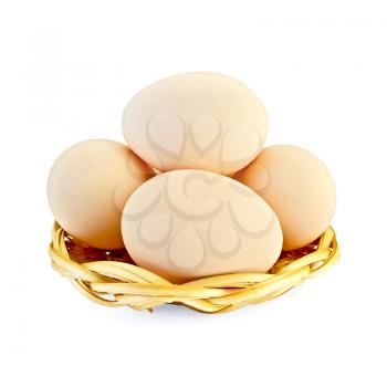 Chicken eggs in a wicker plate isolated on a white background