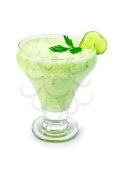 Yogurt in a glass with a cucumber and parsley isolated on a white background