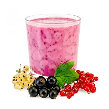 The glass of milkshake, berries black, red and white currants, green leaf isolated on white background