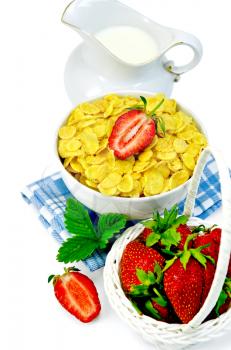 Cornflakes in a white bowl on a napkin, milk jug, strawberries in a white basket isolated on a white background
