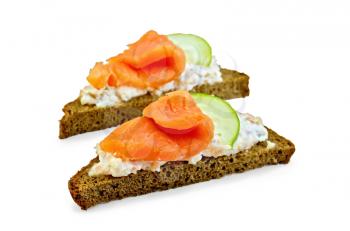 Toast two slices of rye bread with cream, salmon and cucumber isolated on white background