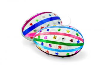 Two easter eggs, decorated with multicolored braid and sparkles in the form of stars isolated on white background