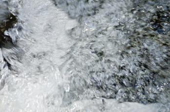The texture of the raging stream of water