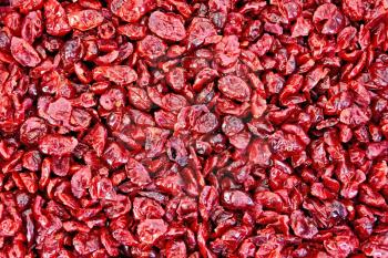 The texture of red candied dried cranberry
