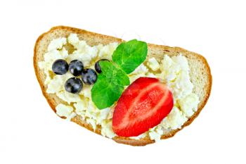 Slice of bread with curd cream, mint, blueberries and strawberries isolated on white background