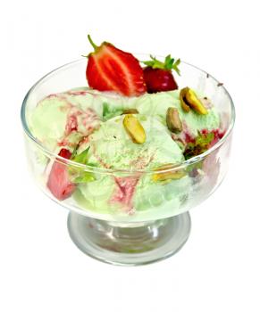 Ice cream strawberry and pistachio in a glass goblet with strawberries and pistachios isolated on white background