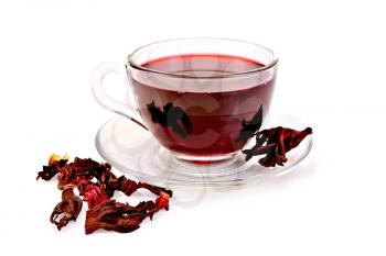 Hibiscus tea in a glass cup, dry petals tea isolated on white background