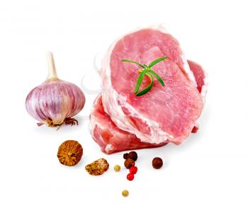 Two slices of pork, rosemary, peppercorns, garlic, nutmeg isolated on white background