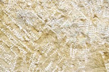 Yellow sandstone with traces of chisels