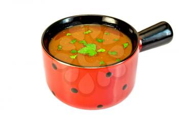 Tomato soup in a red bowl with parsley isolated on white background